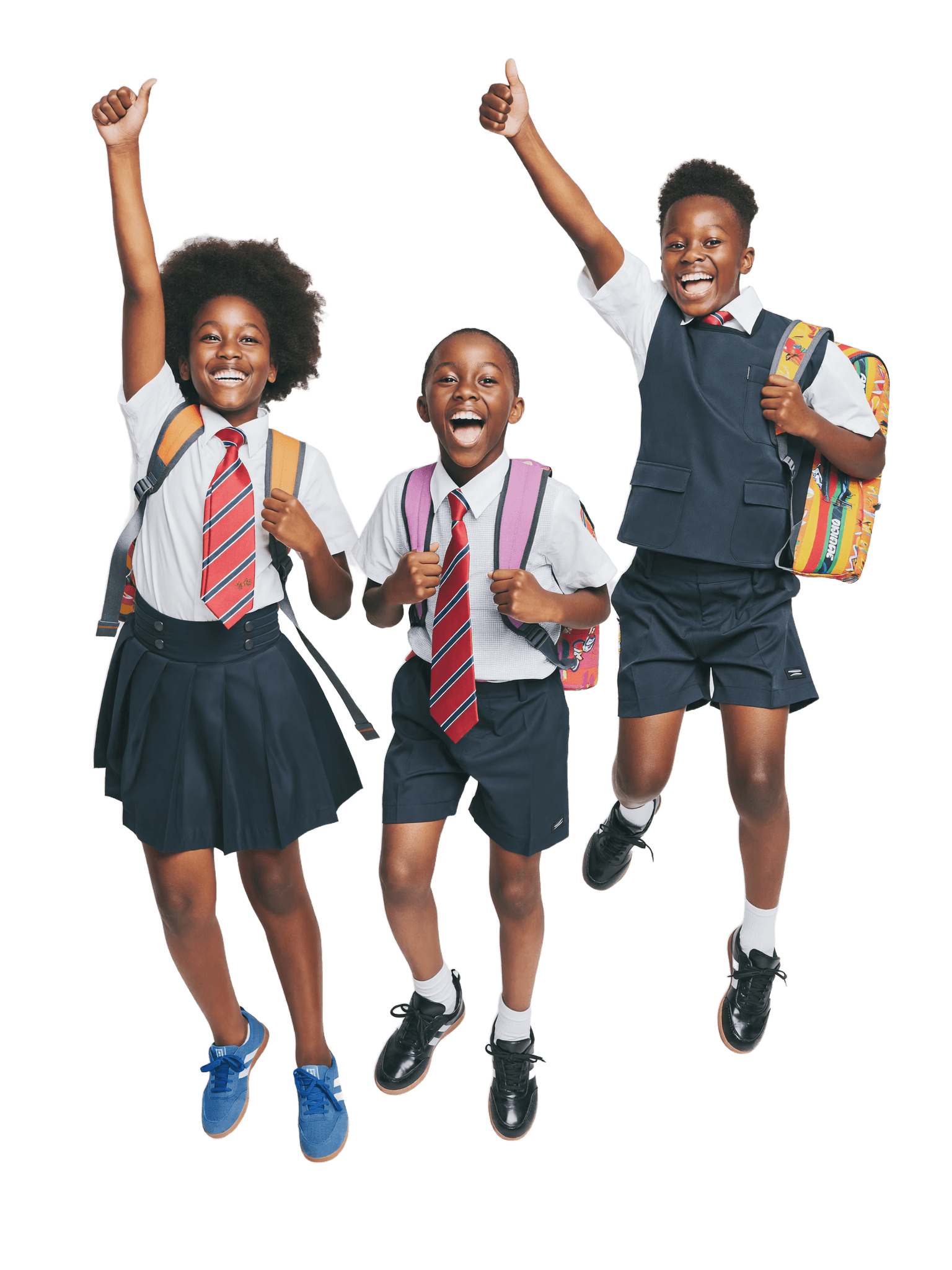 Three excited Joef Dynamic students in uniform jumping for joy with their school bags